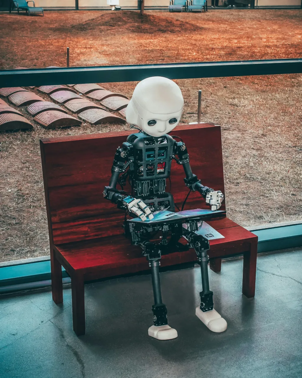 black and white robot toy on red wooden table as a featured image of the future of SEO